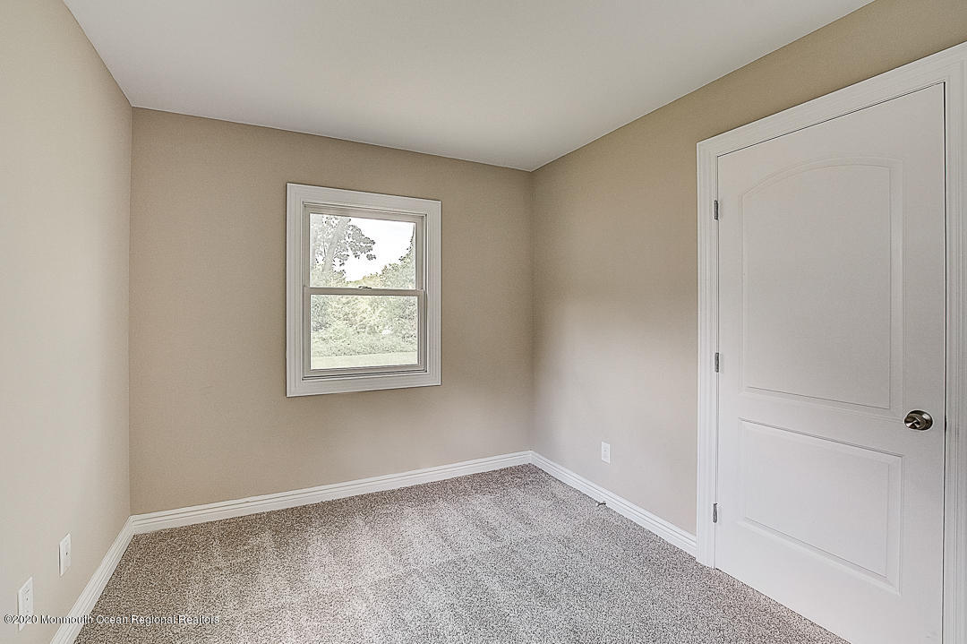 257 Lloyd Road Aberdeen, NJ 07747 - Photo 29 of 46 a view of an empty room with a window
