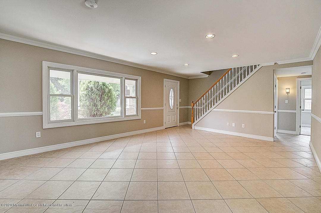 257 Lloyd Road Aberdeen, NJ 07747 - Photo 3 of 46 a view of an empty room with a window