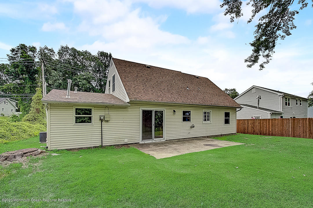 257 Lloyd Road Aberdeen, NJ 07747 - Photo 40 of 46 front view of a house with a yard