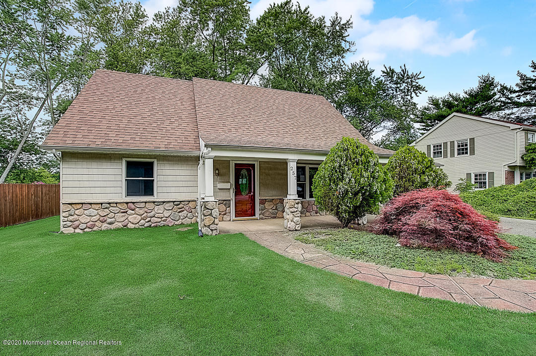 257 Lloyd Road Aberdeen, NJ 07747 - Photo 44 of 46 a view of a house with a yard and a garden