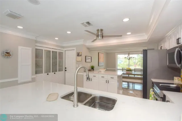 a view of a living room and a large window