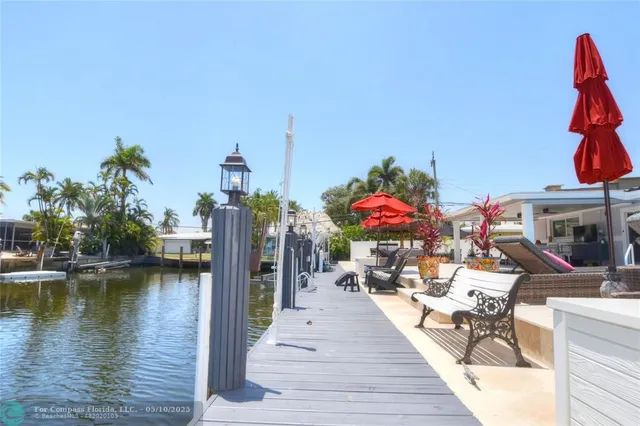 a very nice looking room with many windows and furniture