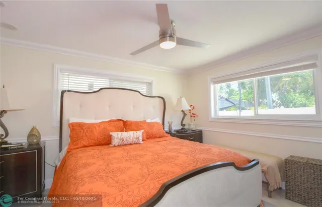 a bedroom with a bed and window