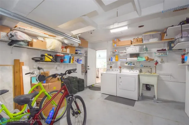 a view of storage and utility room with washer and dryer