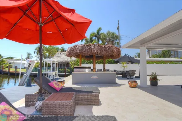 a view of outdoor space with swimming pool and patio