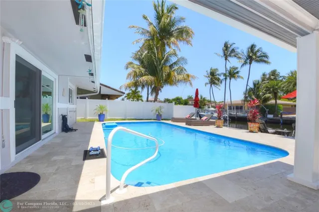 a view of swimming pool with outdoor seating