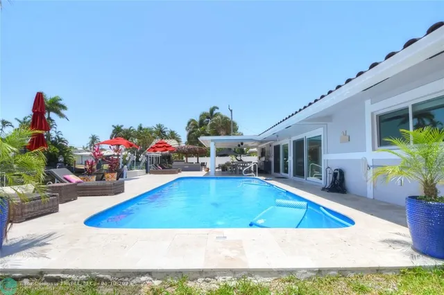 a view of swimming pool with outdoor seating