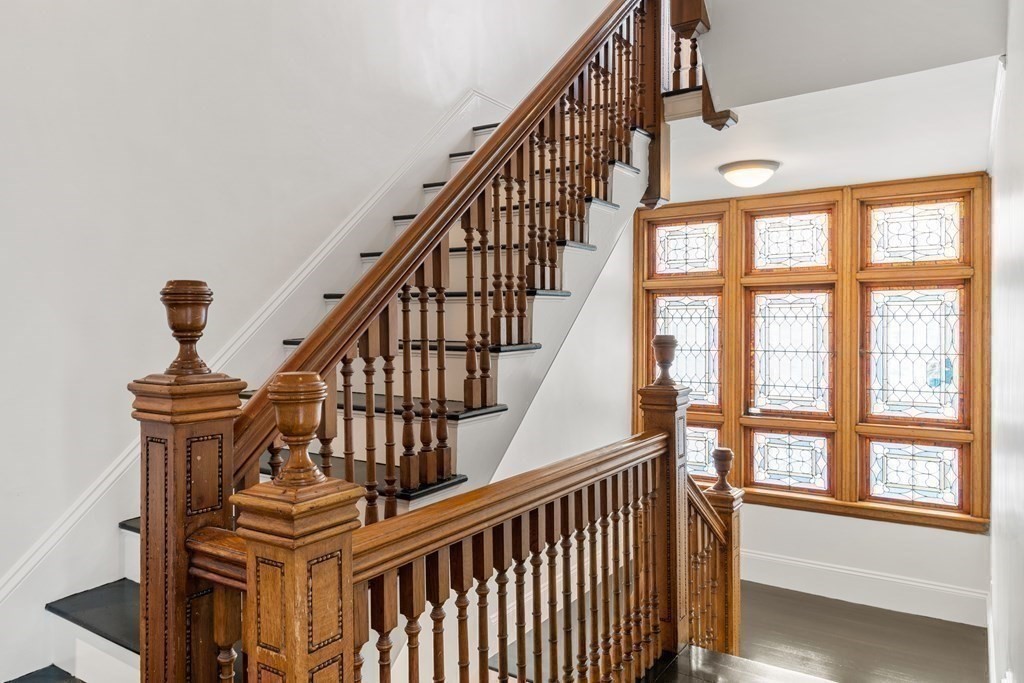 85 Prince Street Newton, MA 02465 - Photo 11 of 37 a view of entryway with wooden floor and a front door