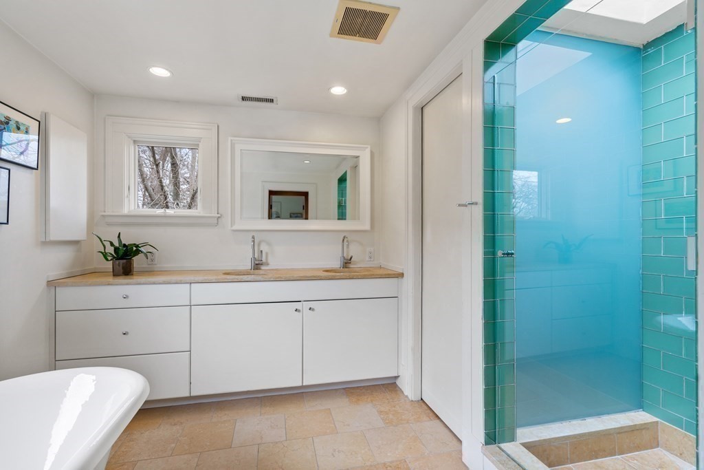 85 Prince Street Newton, MA 02465 - Photo 17 of 37 a spacious bathroom with a double vanity sink and a mirror