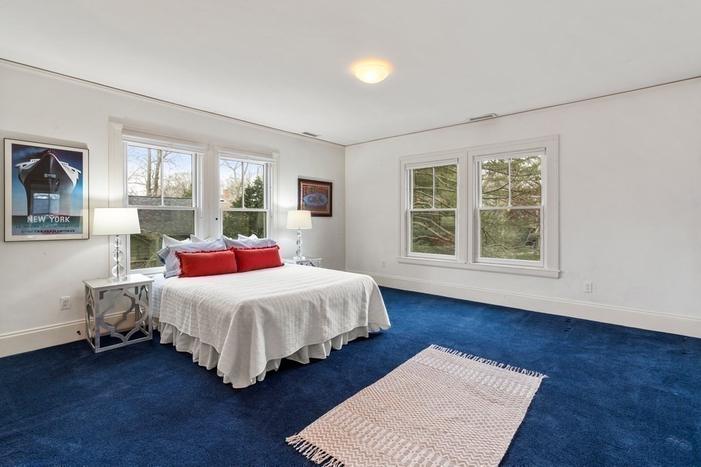 85 Prince Street Newton, MA 02465 - Photo 19 of 37 a bedroom with a bed wooden floor and window