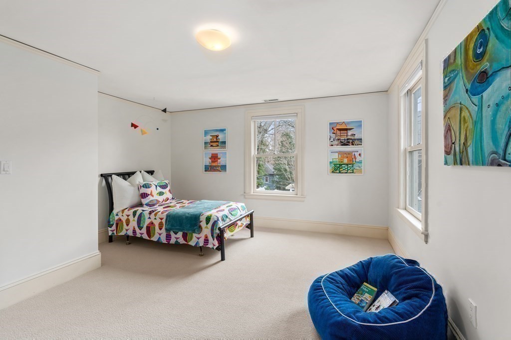 85 Prince Street Newton, MA 02465 - Photo 20 of 37 a bedroom with a bed and a couch