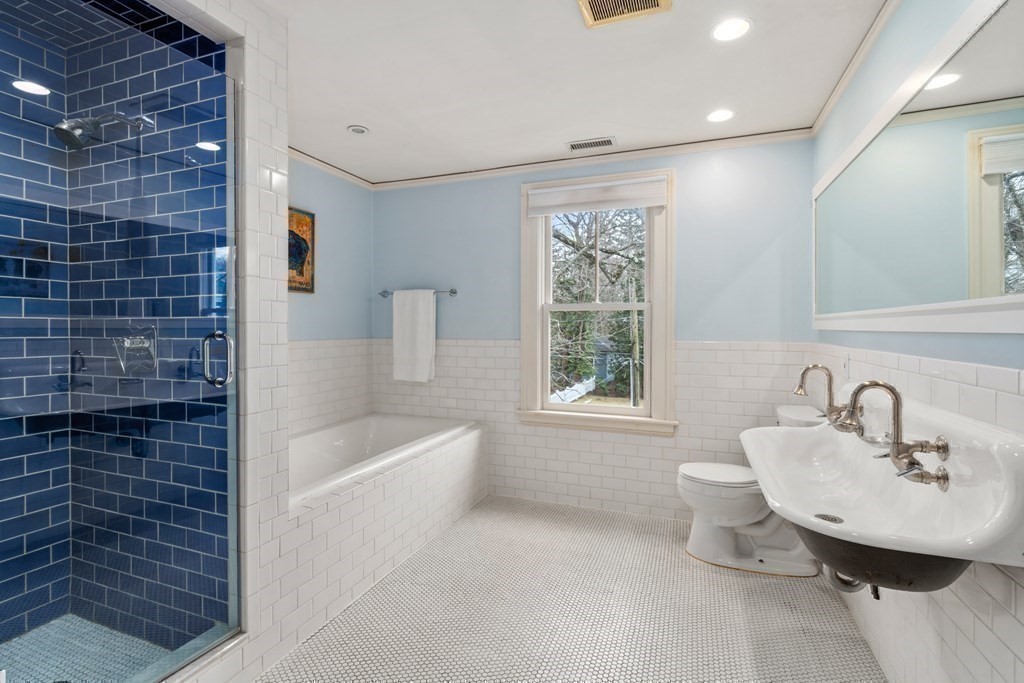 85 Prince Street Newton, MA 02465 - Photo 21 of 37 a bathroom with a sink bathtub and a shower