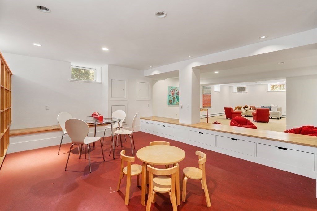 85 Prince Street Newton, MA 02465 - Photo 27 of 37 a living room with furniture and a table