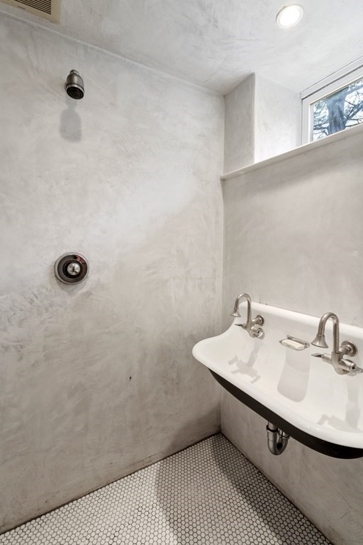 85 Prince Street Newton, MA 02465 - Photo 31 of 37 a bathroom with a sink and a mirror