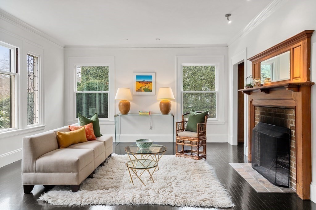 85 Prince Street Newton, MA 02465 - Photo 4 of 37 a living room with furniture and a fireplace
