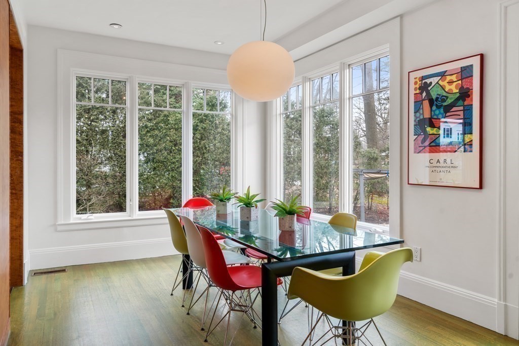 85 Prince Street Newton, MA 02465 - Photo 9 of 37 a dining room with furniture a chandelier and wooden floor