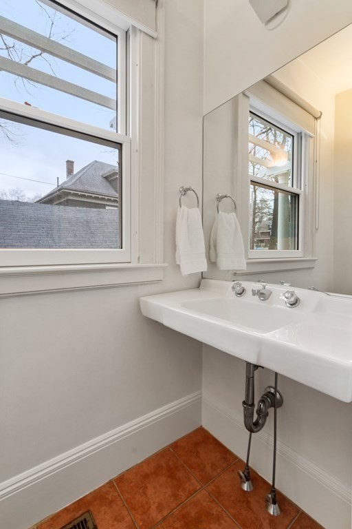 85 Prince Street Newton, MA 02465 - Photo 10 of 37 a bathroom with a sink and a window