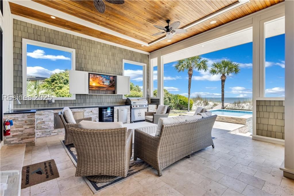 15 Grey Widgeon Road Hilton Head Island, SC 29928 - Photo 17 of 65 Conversation area includes outdoor kitchen and TV