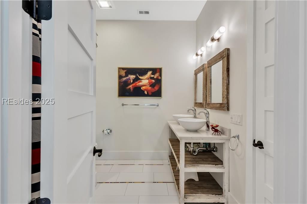 15 Grey Widgeon Road Hilton Head Island, SC 29928 - Photo 33 of 65 Double vanity and tub shower in bunk room bath