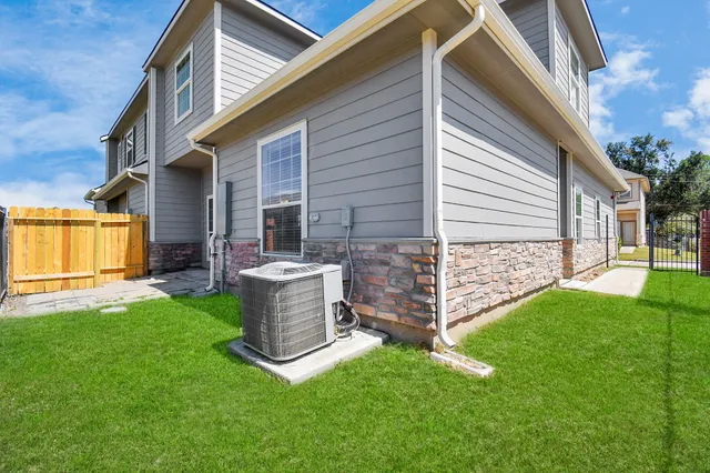 a view of a house with a yard and stairs