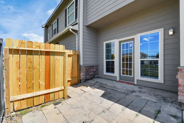 a view of a brick house with a large windows