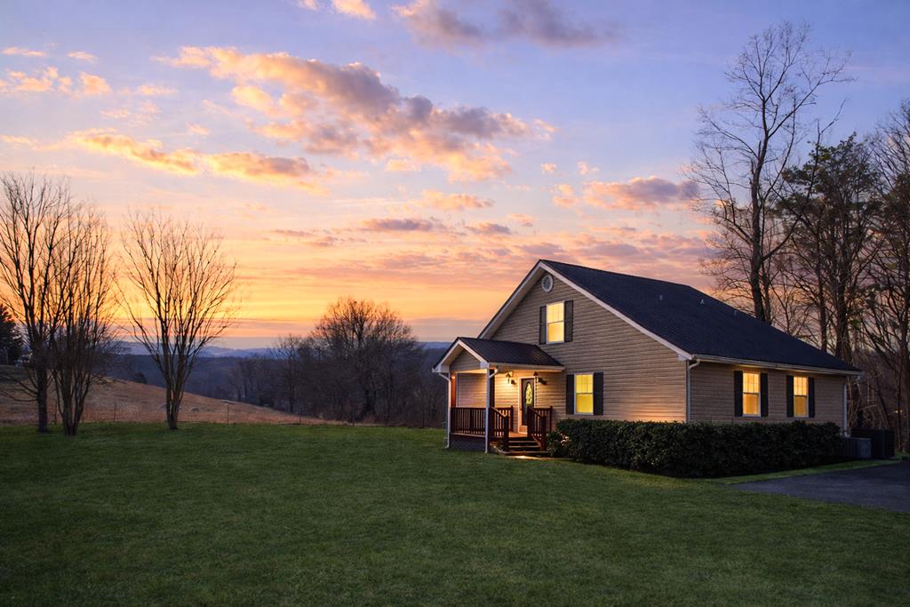 65 Ivy Ridge Ellijay, GA 30536 - Photo 1 of 28 a front view of a house with a garden