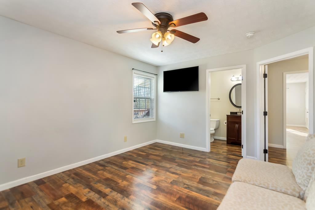 65 Ivy Ridge Ellijay, GA 30536 - Photo 14 of 28 a bedroom with a large bed and a flat screen tv