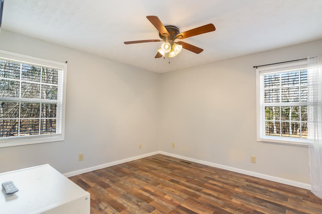 65 Ivy Ridge Ellijay, GA 30536 - Photo 16 of 28 a view of an empty room with a window and wooden floor