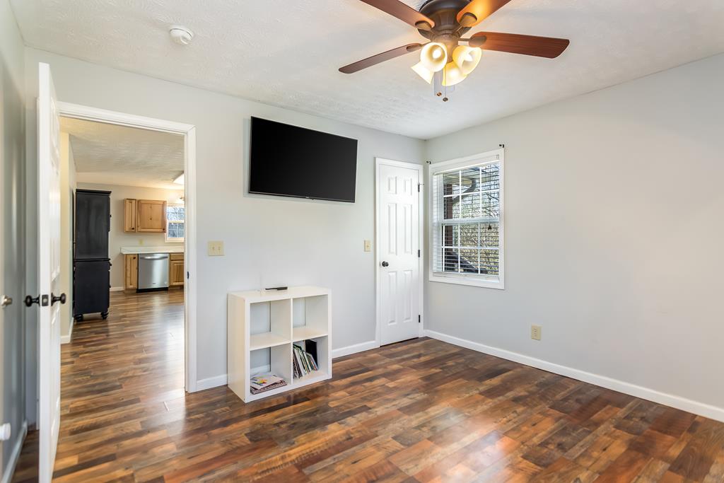 65 Ivy Ridge Ellijay, GA 30536 - Photo 17 of 28 a view of empty room with wooden floor and fan