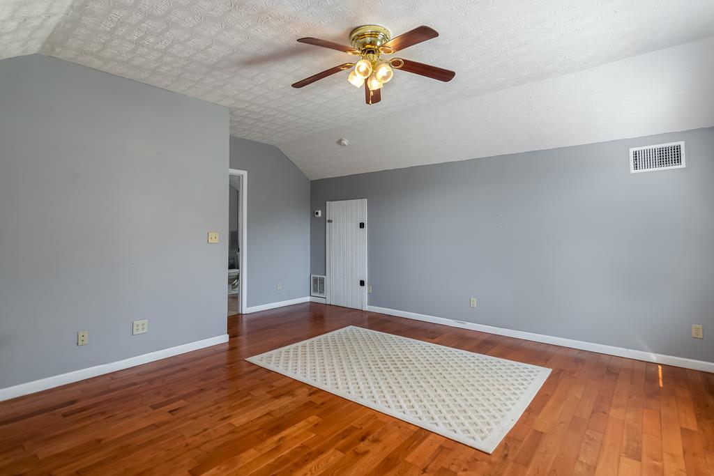 65 Ivy Ridge Ellijay, GA 30536 - Photo 23 of 28 a view of empty room with wooden floor