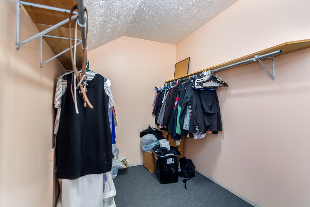 65 Ivy Ridge Ellijay, GA 30536 - Photo 26 of 28 a view of walk in closet with clothes and shoes