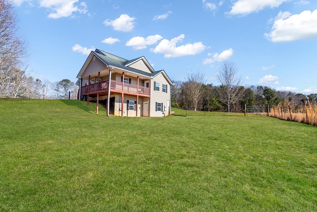 65 Ivy Ridge Ellijay, GA 30536 - Photo 4 of 28 a view of a house with a big yard
