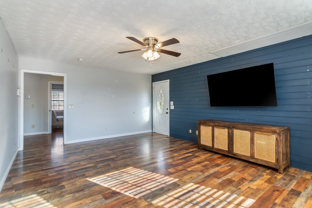 65 Ivy Ridge Ellijay, GA 30536 - Photo 6 of 28 a view of an empty room with window and wooden floor