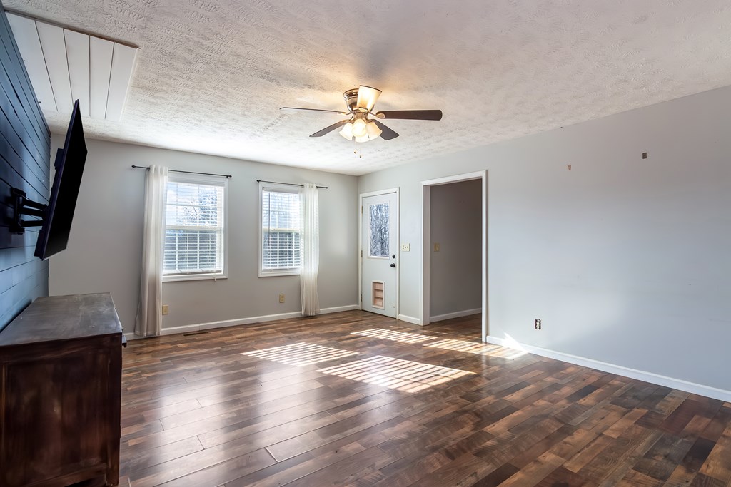 65 Ivy Ridge Ellijay, GA 30536 - Photo 7 of 28 a view of livingroom with hardwood floor and a ceiling fan