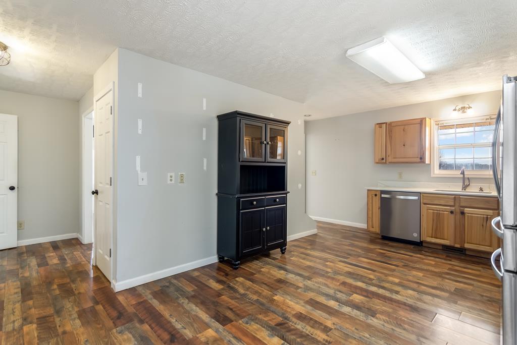 65 Ivy Ridge Ellijay, GA 30536 - Photo 9 of 28 a kitchen with a refrigerator and a stove top oven