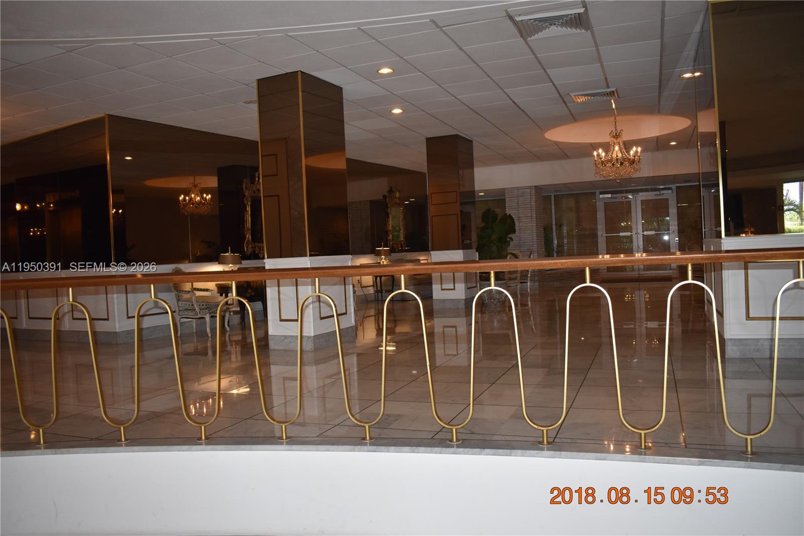 5255 Collins Avenue, Unit 4F Miami Beach, FL 33140 - Photo 18 of 20 a bunch of table room with wooden floor and windows