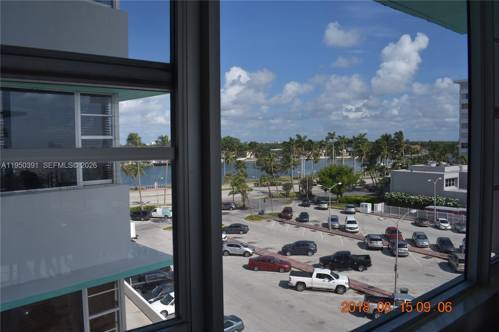 5255 Collins Avenue, Unit 4F Miami Beach, FL 33140 - Photo 6 of 20 a view of a balcony with chair and tables