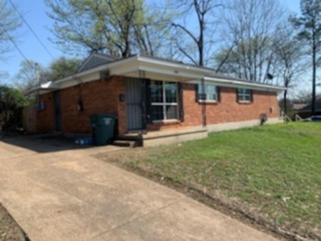 802 Pendleton Street Memphis, TN 38114 - Photo 11 of 22 a front view of a house with a yard and garage