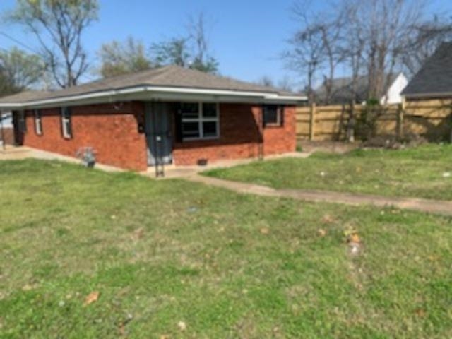 802 Pendleton Street Memphis, TN 38114 - Photo 13 of 22 a front view of a house with a yard
