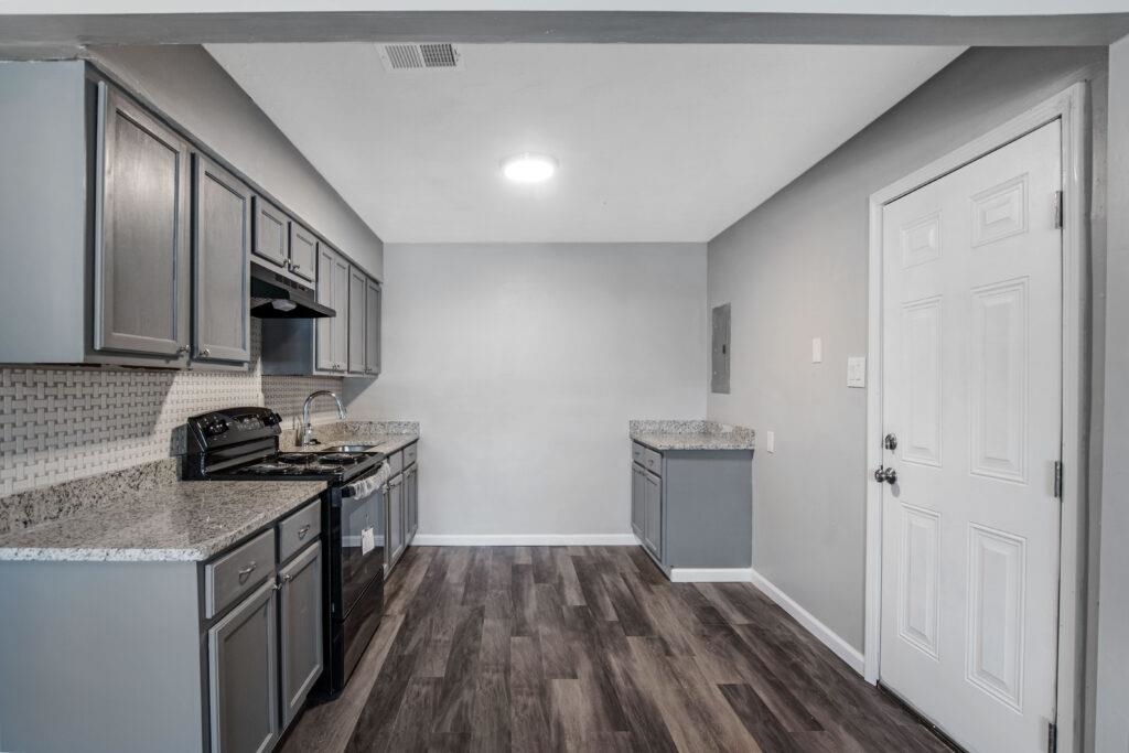 802 Pendleton Street Memphis, TN 38114 - Photo 15 of 22 a kitchen with a sink stove top oven and cabinets