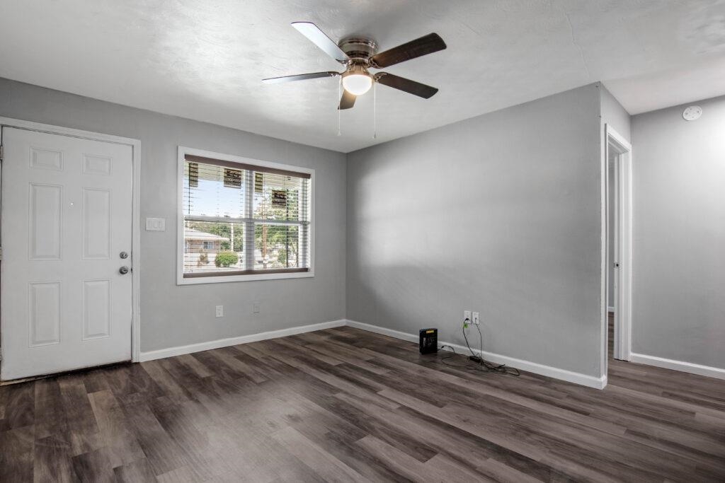 802 Pendleton Street Memphis, TN 38114 - Photo 18 of 22 a view of empty room with wooden floor and fan