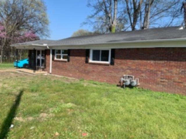 802 Pendleton Street Memphis, TN 38114 - Photo 7 of 22 a front view of a house with a yard and a garage