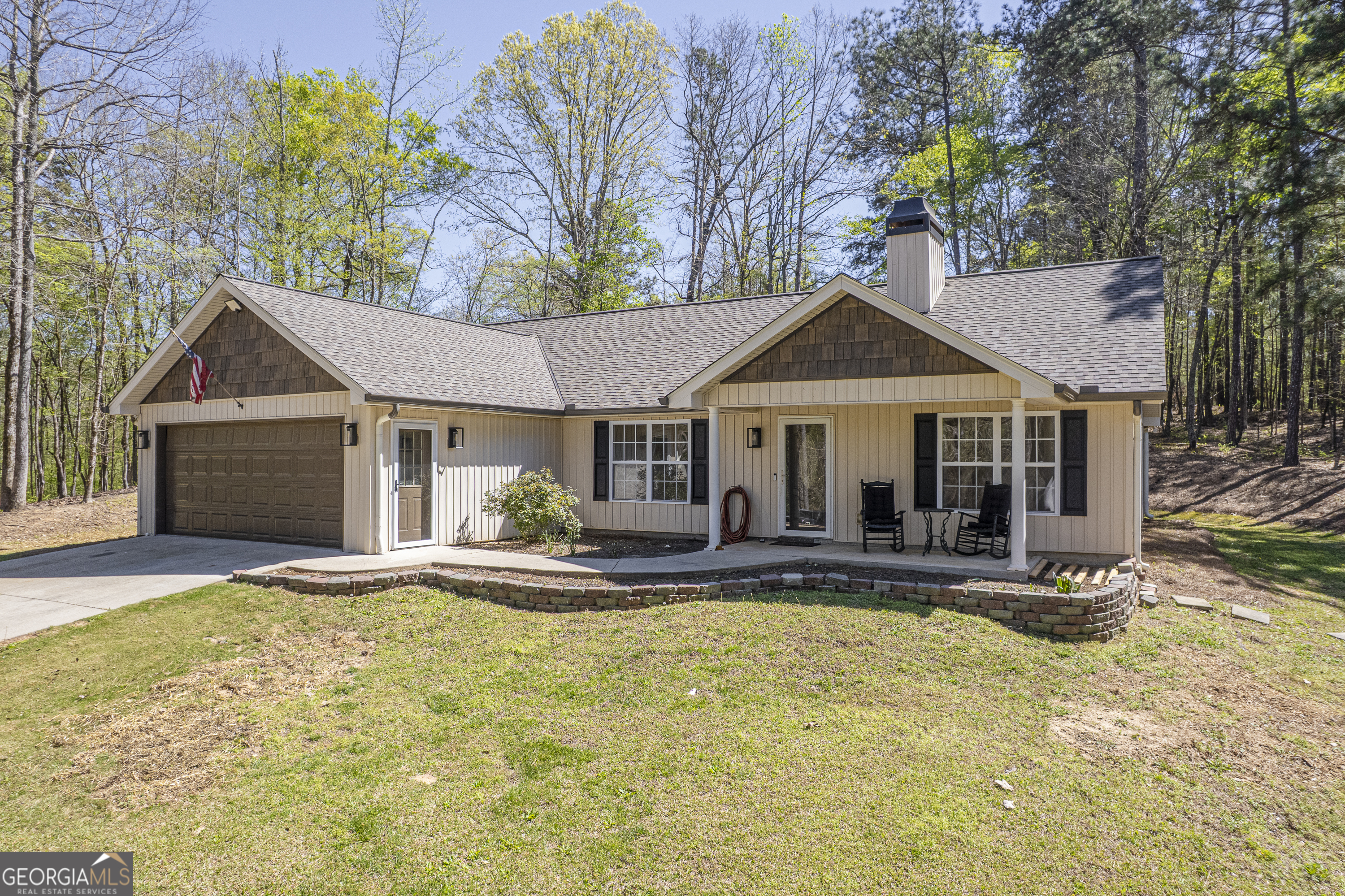 176 Arrowhead Trail Eatonton, GA 31024 - Photo 1 of 45 a front view of a house with swimming pool and porch with furniture
