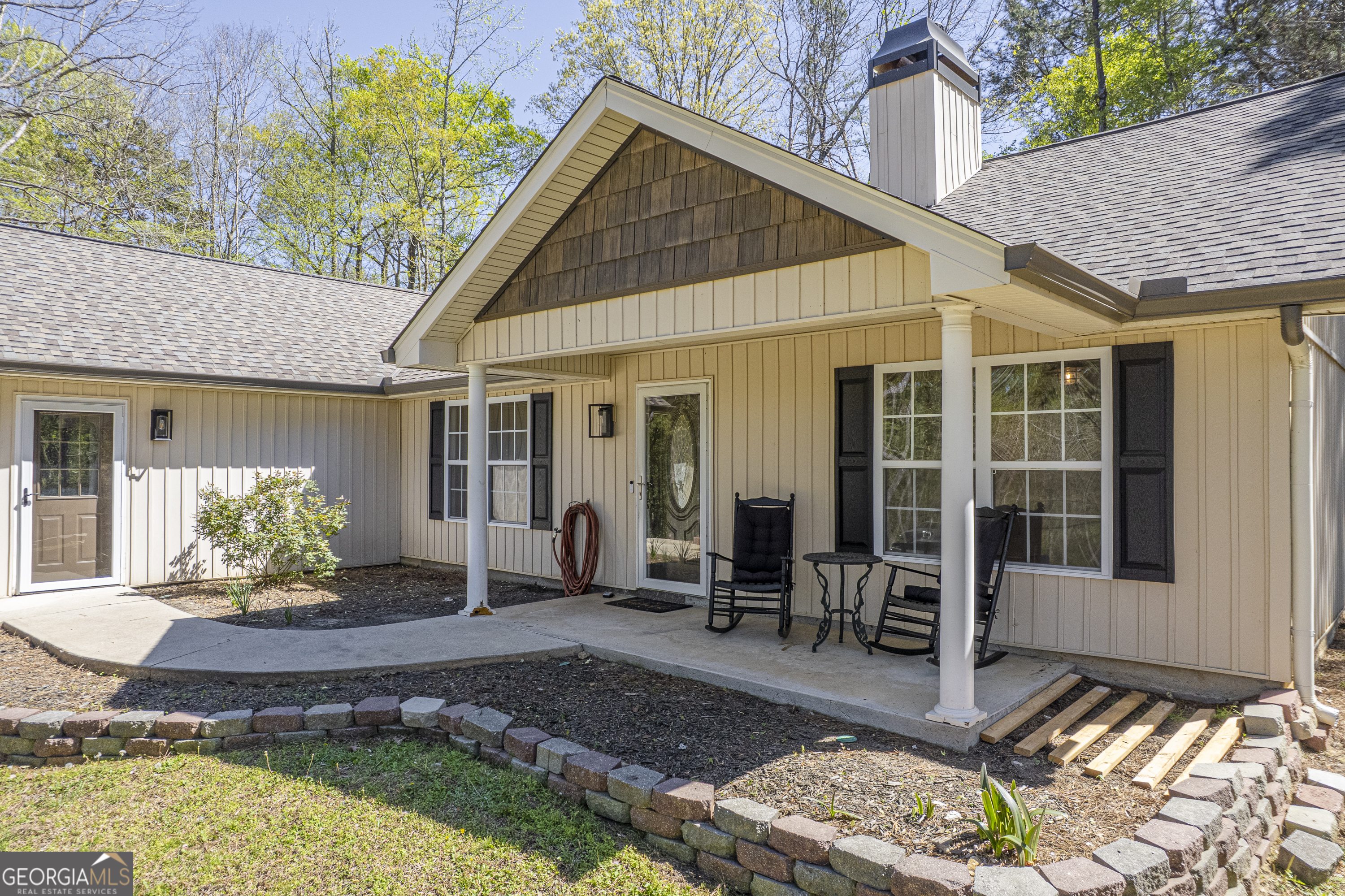176 Arrowhead Trail Eatonton, GA 31024 - Photo 2 of 45 a front view of a house with outdoor seating