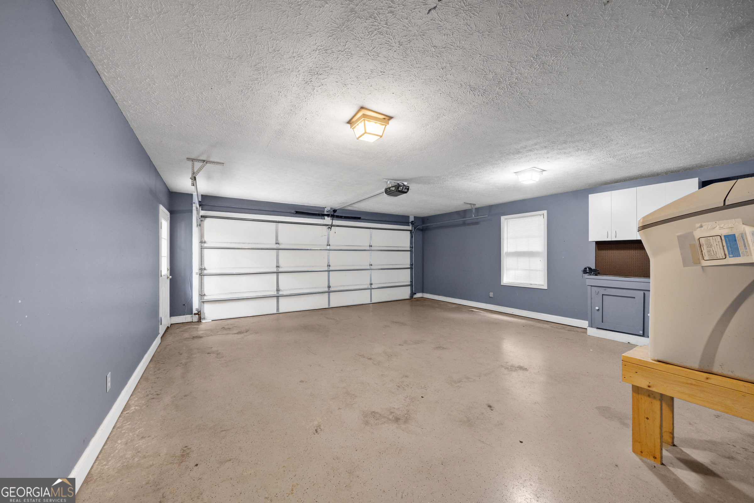 176 Arrowhead Trail Eatonton, GA 31024 - Photo 26 of 45 a view of empty room with windows and ceiling fan