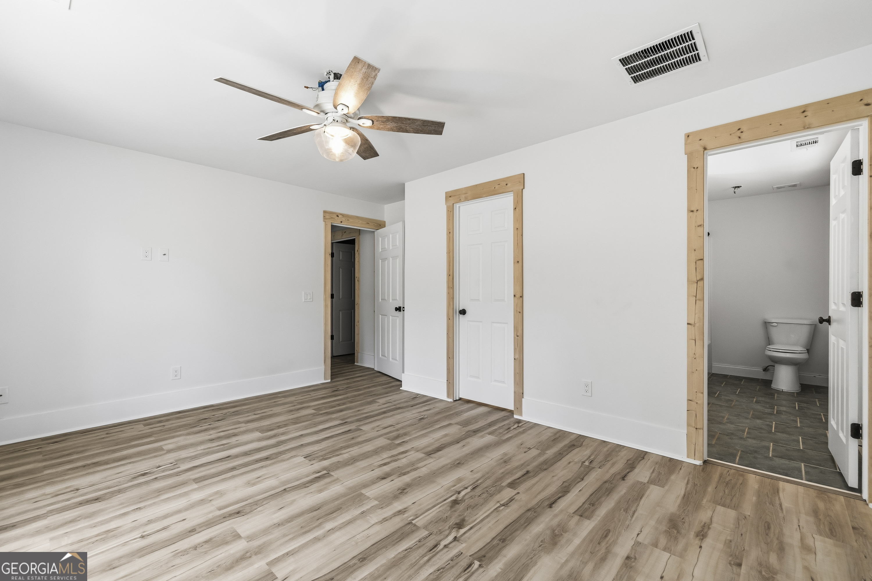 176 Arrowhead Trail Eatonton, GA 31024 - Photo 28 of 45 a view of empty room with wooden floor