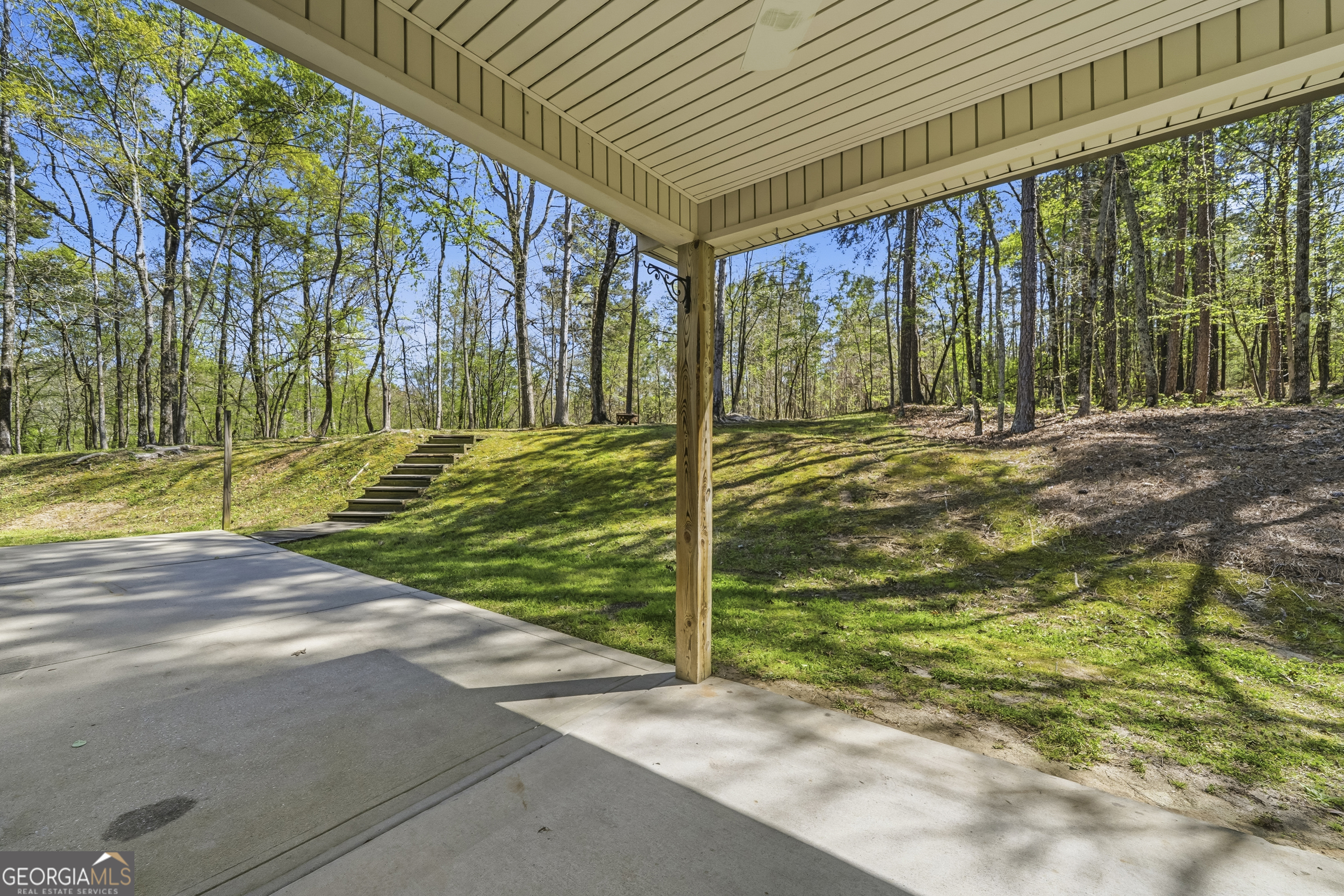 176 Arrowhead Trail Eatonton, GA 31024 - Photo 31 of 45 a view of a back yard of the house