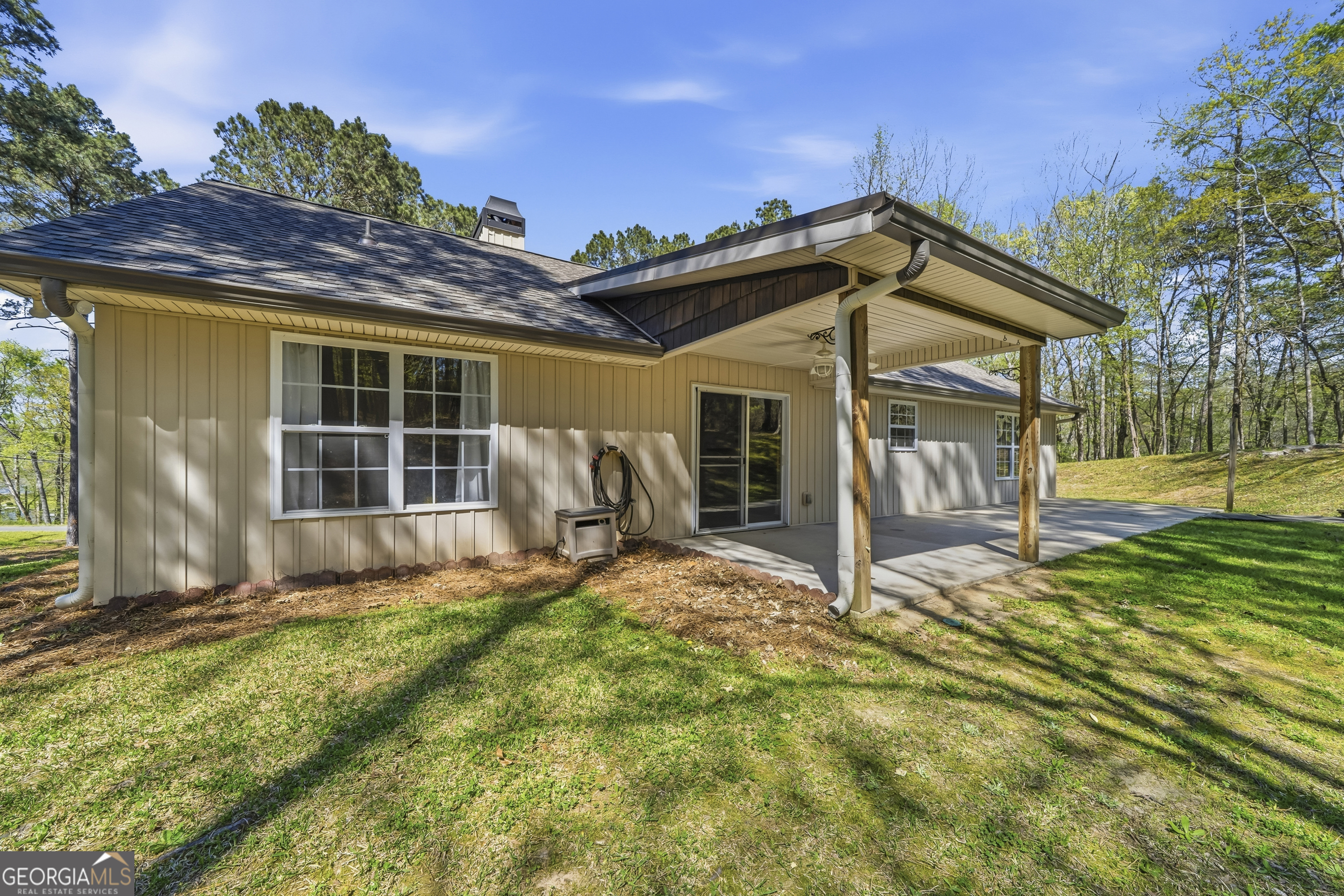 176 Arrowhead Trail Eatonton, GA 31024 - Photo 35 of 45 a view of a house with backyard and sitting area