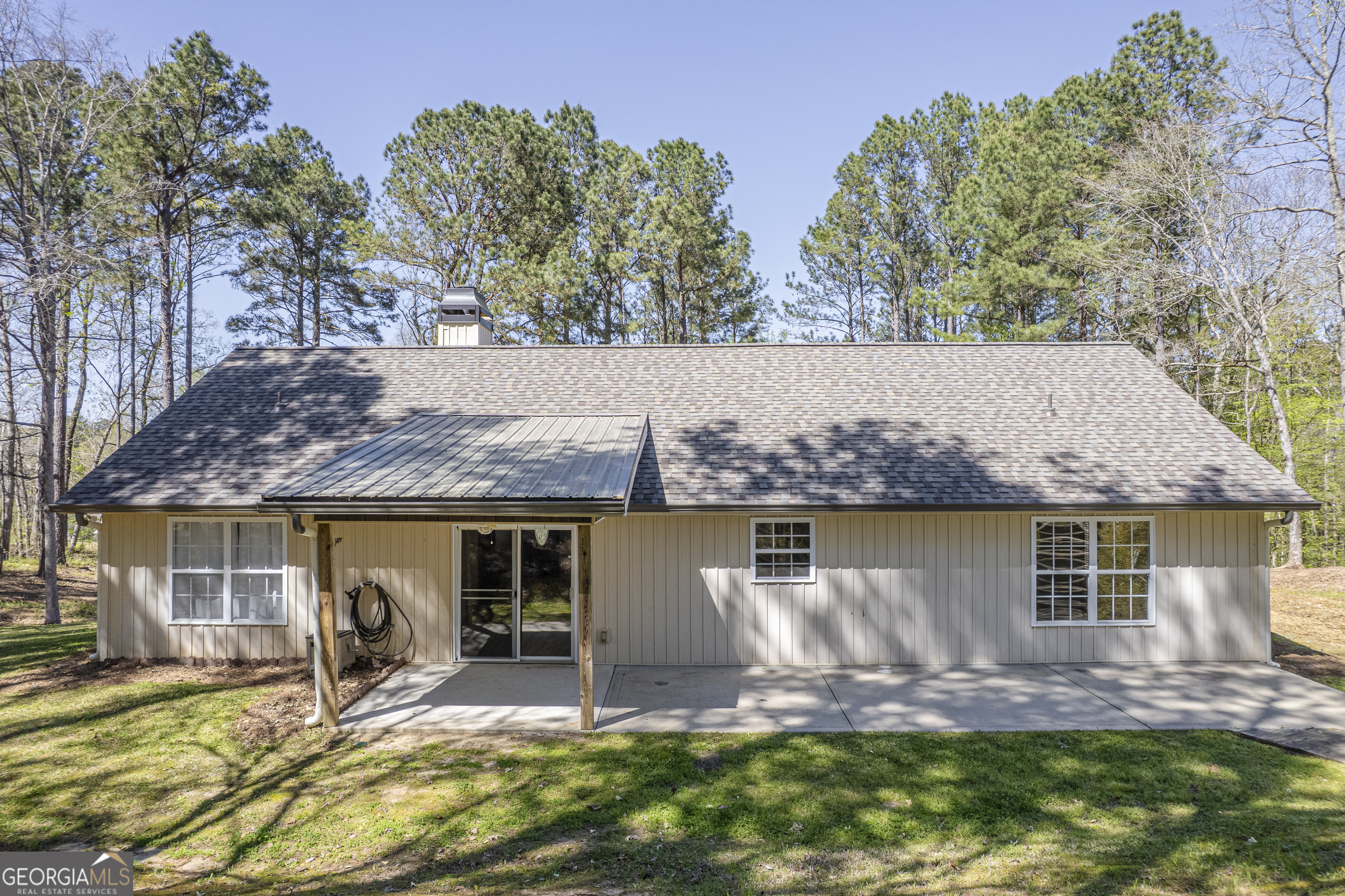 176 Arrowhead Trail Eatonton, GA 31024 - Photo 37 of 45 a view of house with backyard outdoor seating and yard