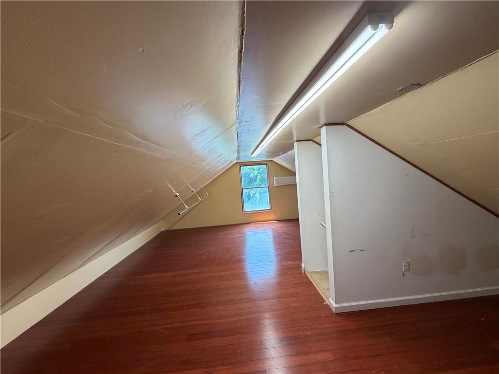 2552 Spring Street Coplay, PA 18037 - Photo 33 of 33 Hardwood flooring extends throughout this versatile attic space, offering ample natural light.